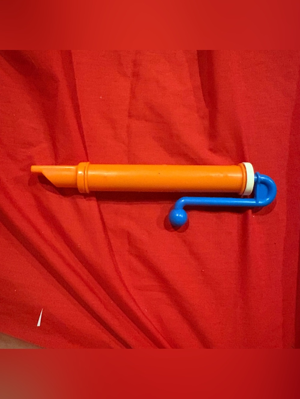 fisher price 1988 sliding whistle with a blue slider
